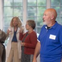 faculty standing and talking